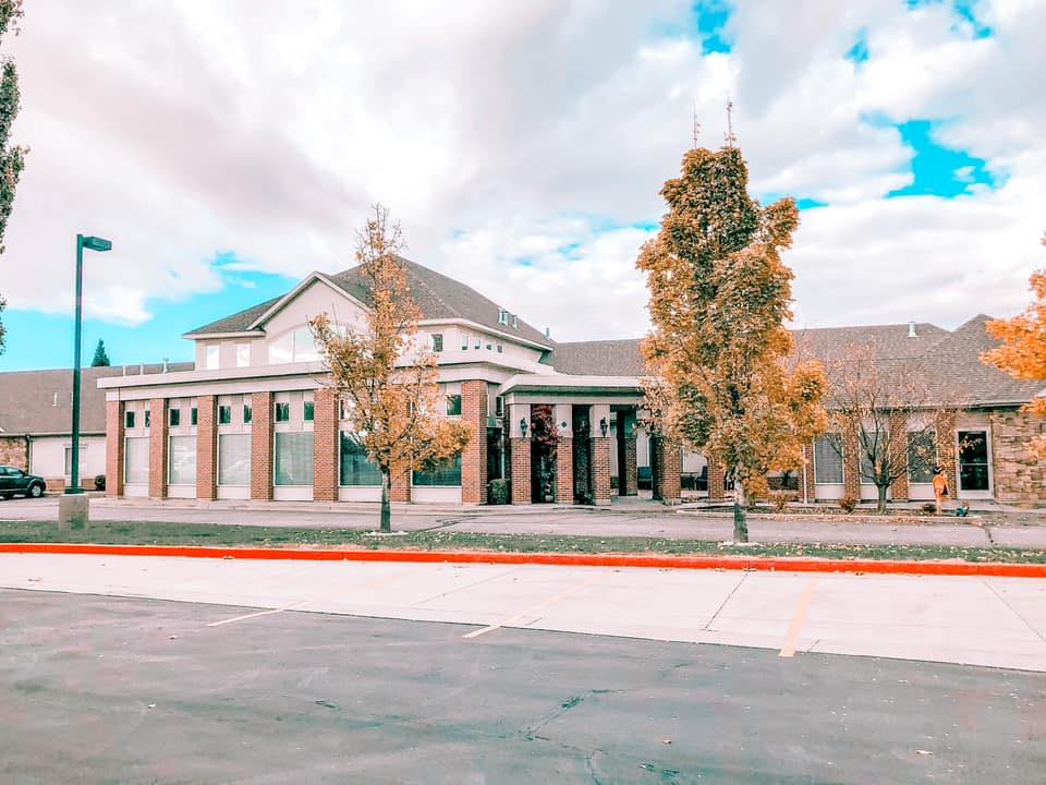 Exterior view of Family Tree Assisted Living building with trees