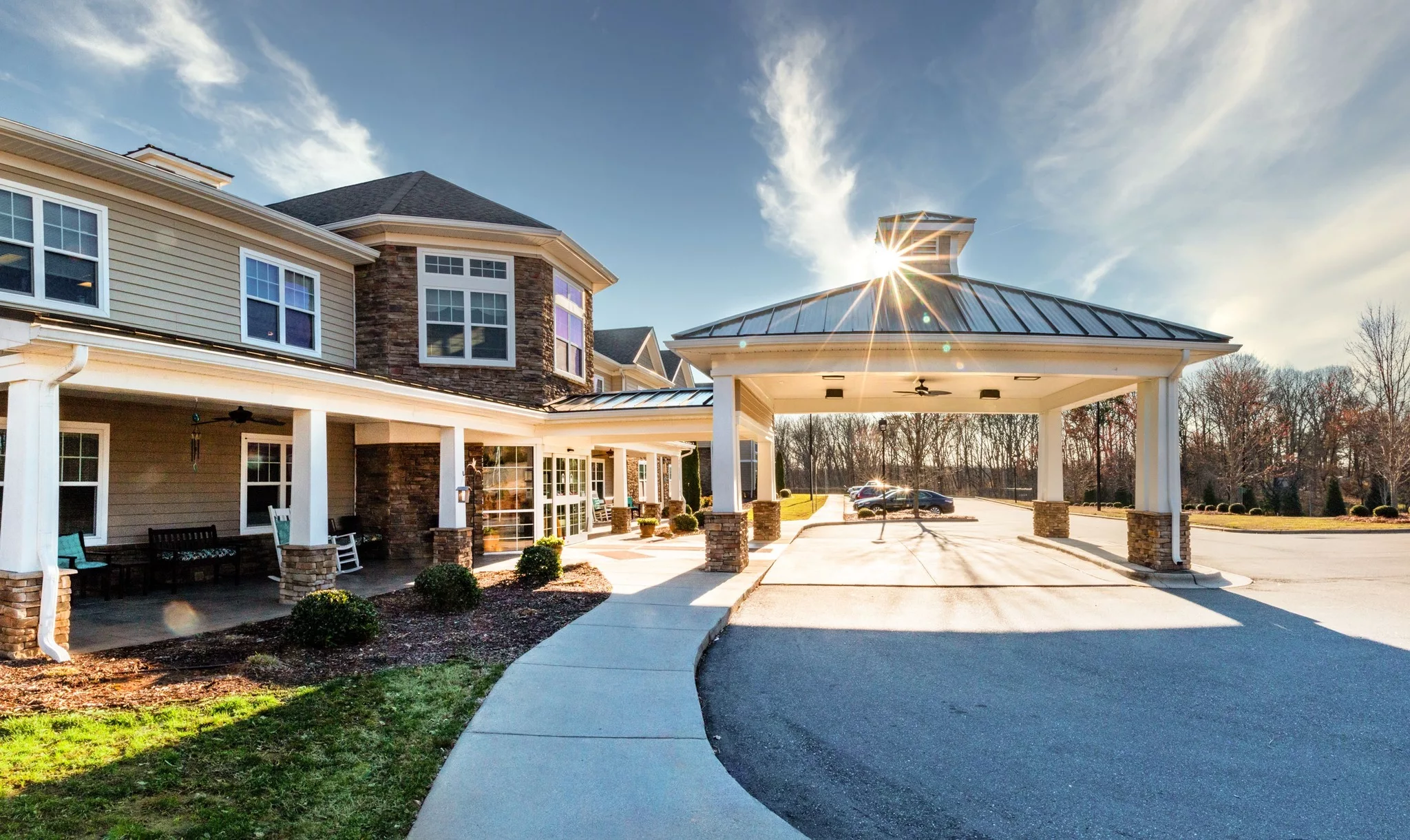Building exterior with covered entrance and landscaping
