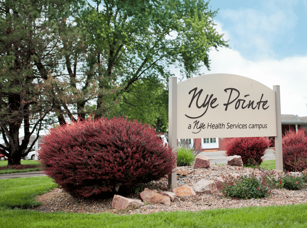Signage for Nye Pointe with landscaping