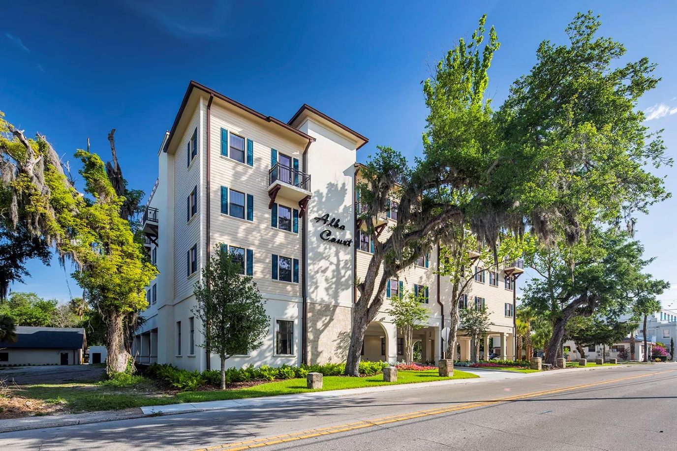Exterior view of a senior living facility with landscaping