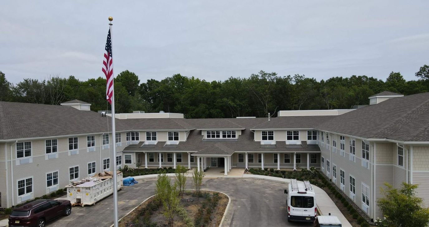 Aerial view of the assisted living facility with flag