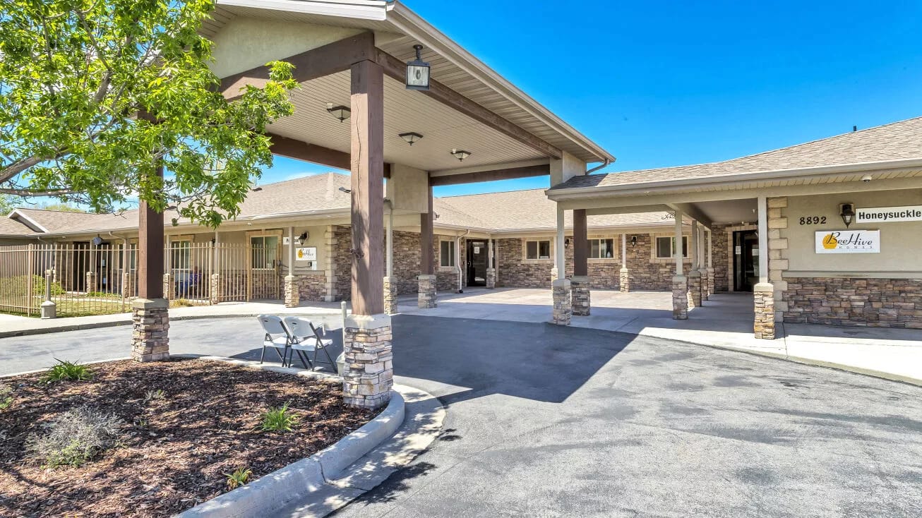 Front entrance of a senior living facility with stone accents