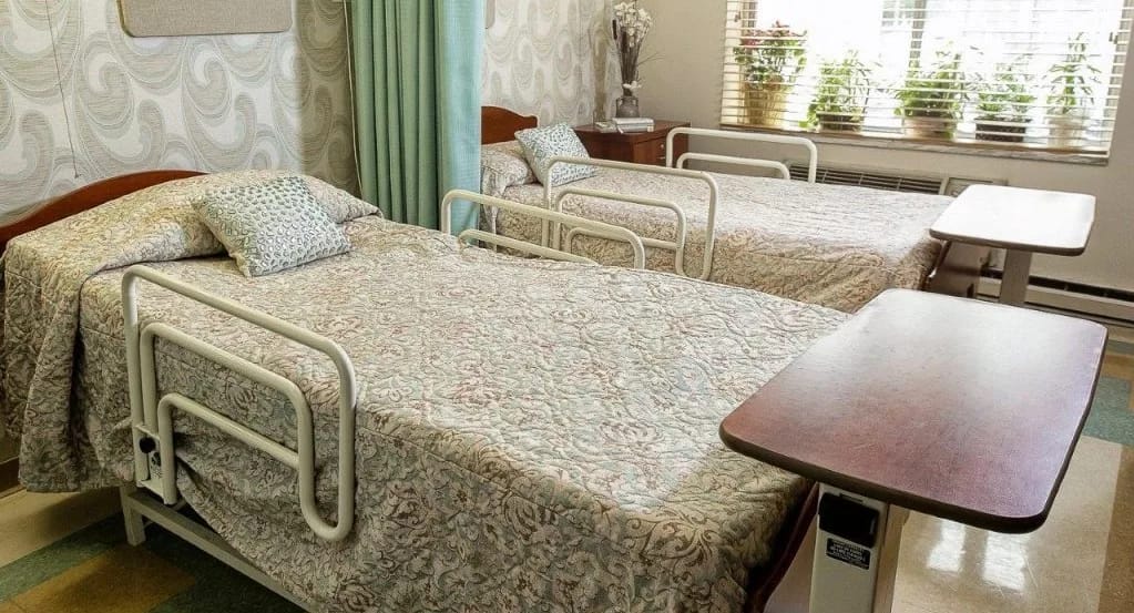 Two resident beds in a well-lit room