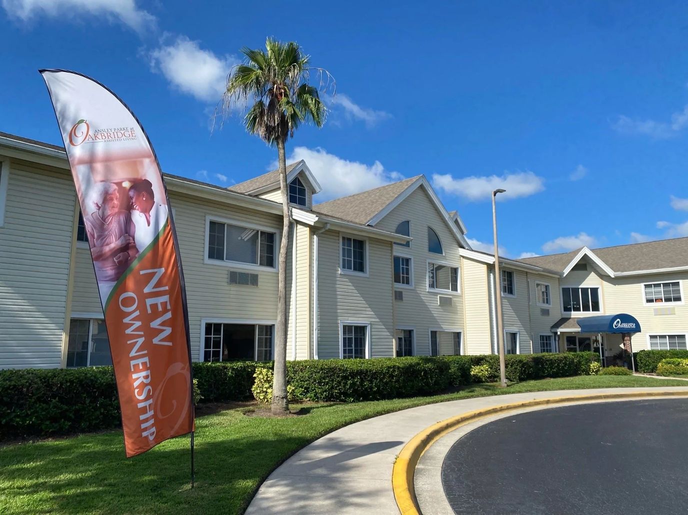 Exterior view of the facility with a 'New Ownership' banner