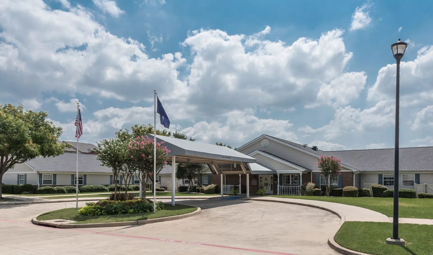 Exterior view of Arden Courts of Richardson with entrance awning