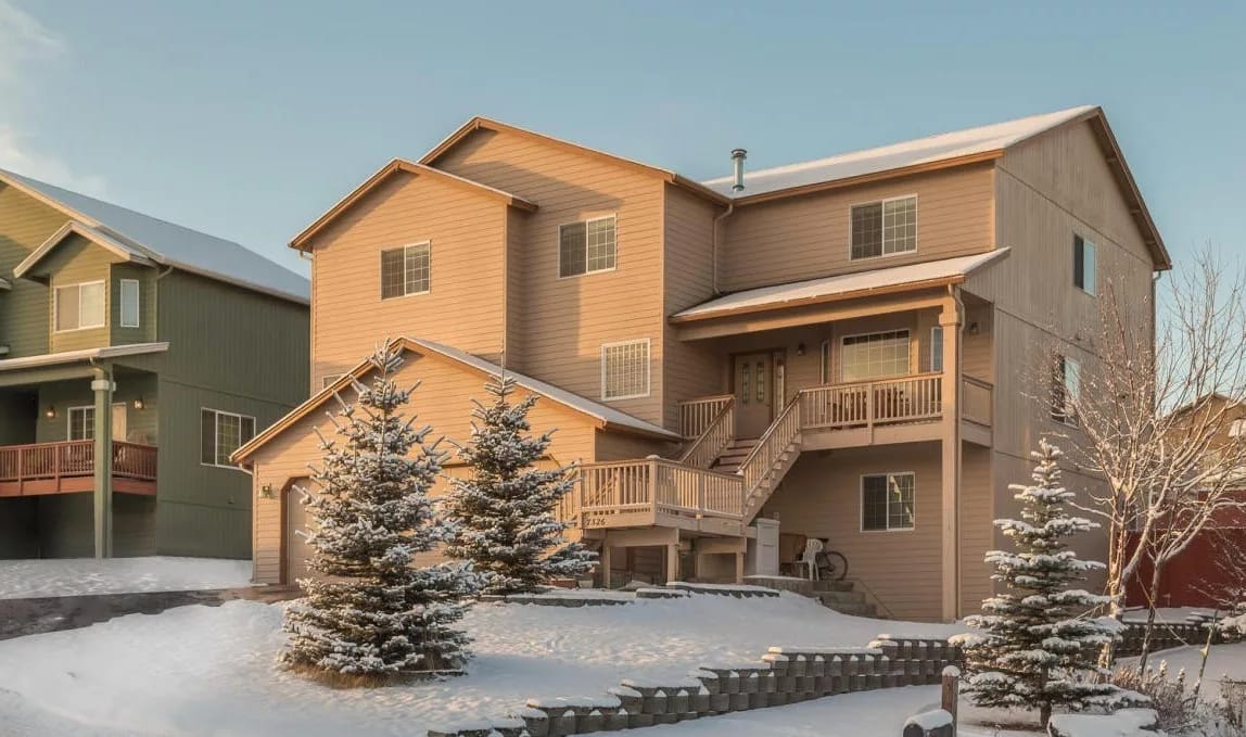 Exterior view of a multi-level residential building in winter