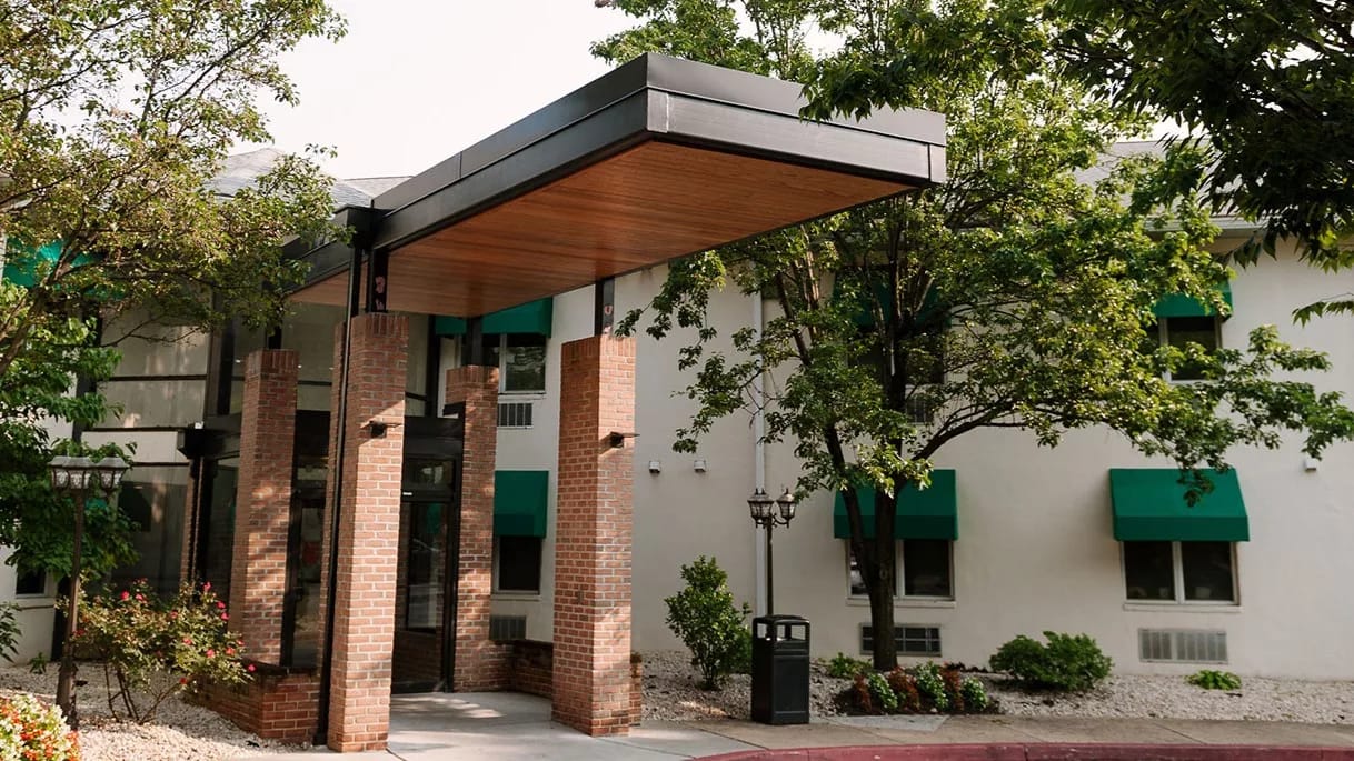 Exterior view of the facility entrance with landscaping