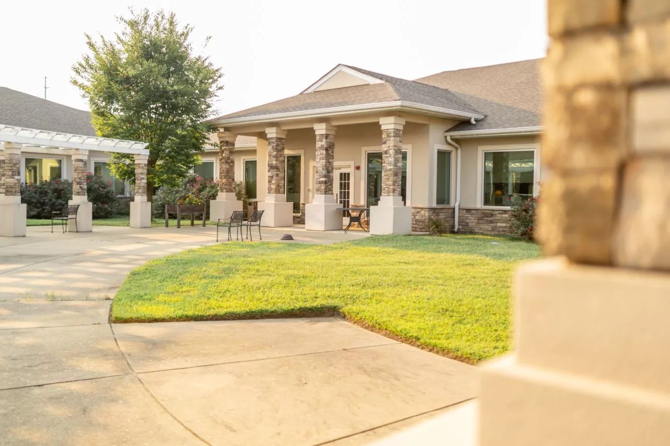 Exterior view of the assisted living facility with lawn