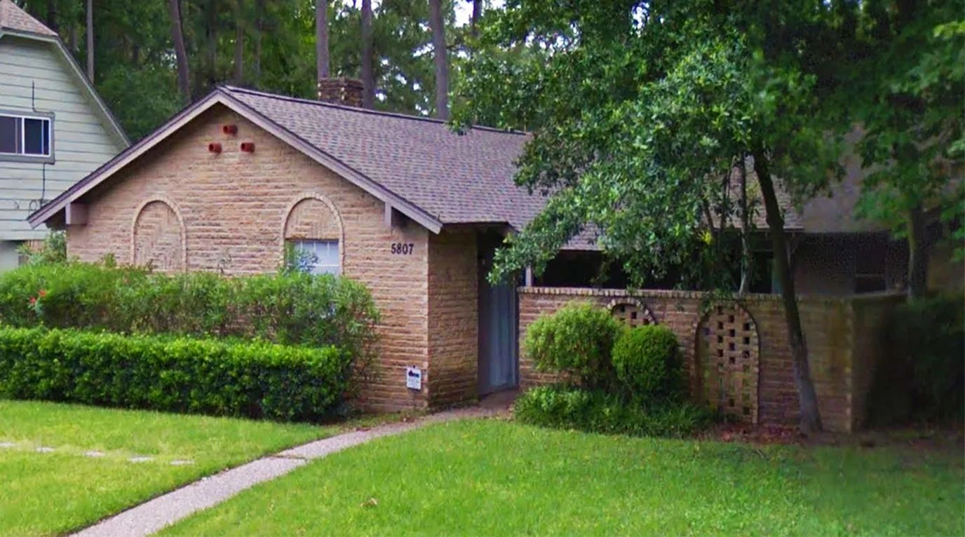 Exterior view of a senior living facility with landscaping