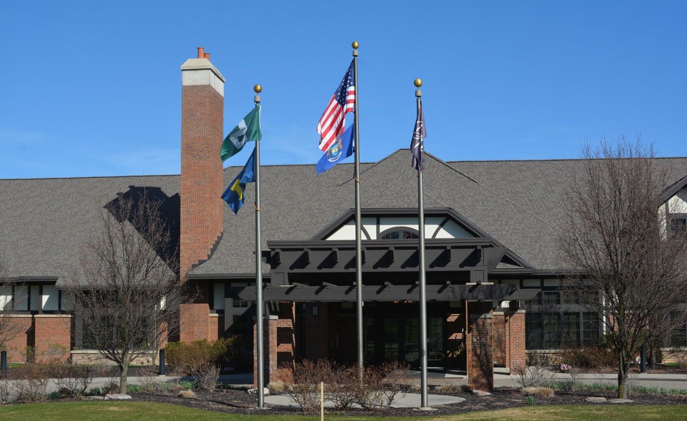 Front entrance of Beacon Hill at Eastgate with flags