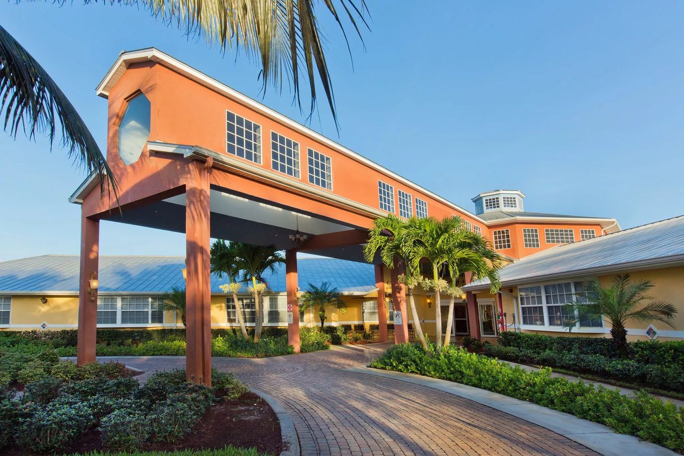 Exterior view of Barrington Terrace with palm trees