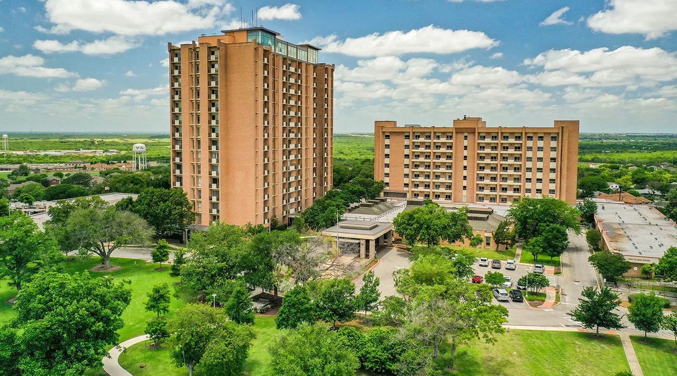 Aerial view of assisted living facility with gardens