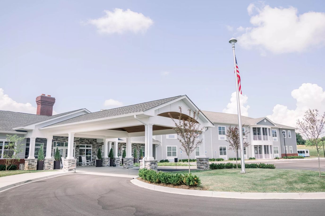 Exterior view of Bluegrass Senior Living facility with entrance