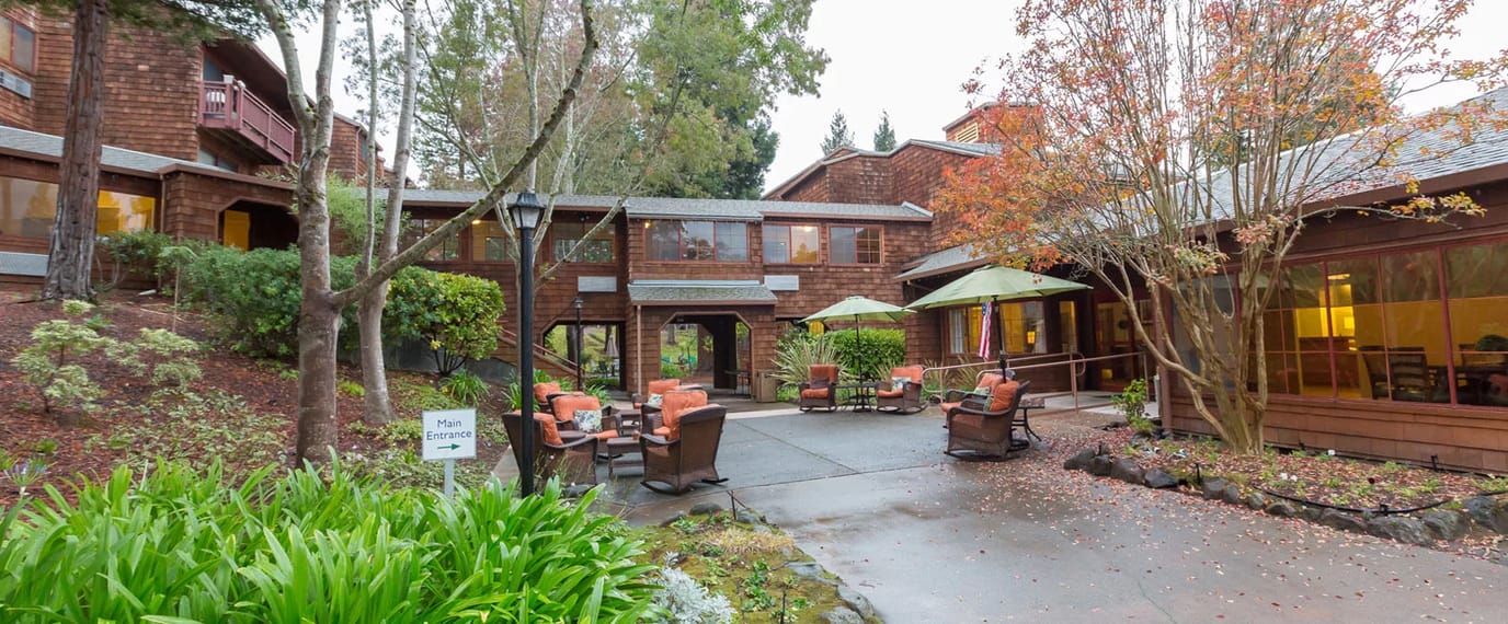 Outdoor seating area with green landscaping