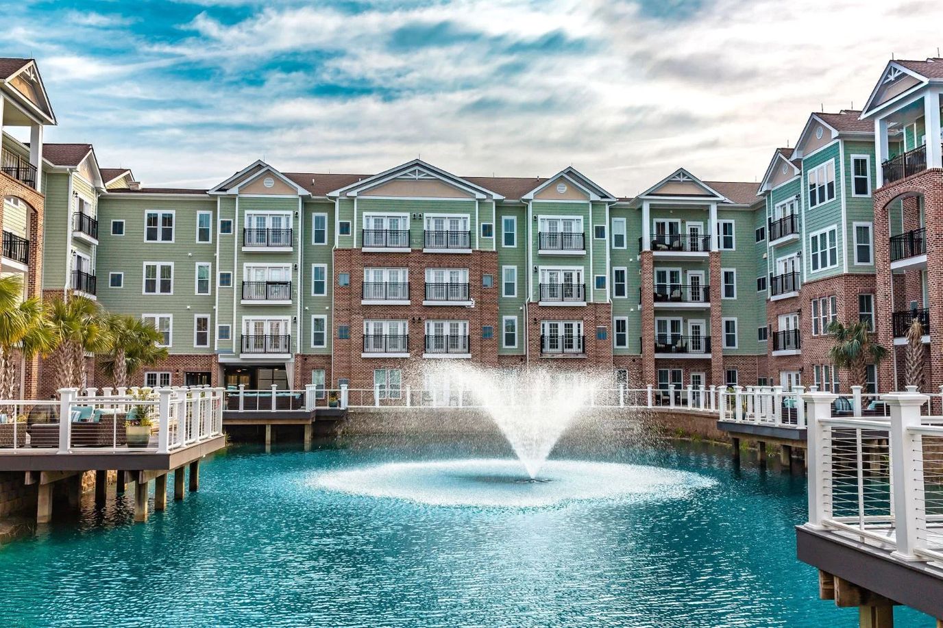 Exterior view of Cambridge Village with water fountain