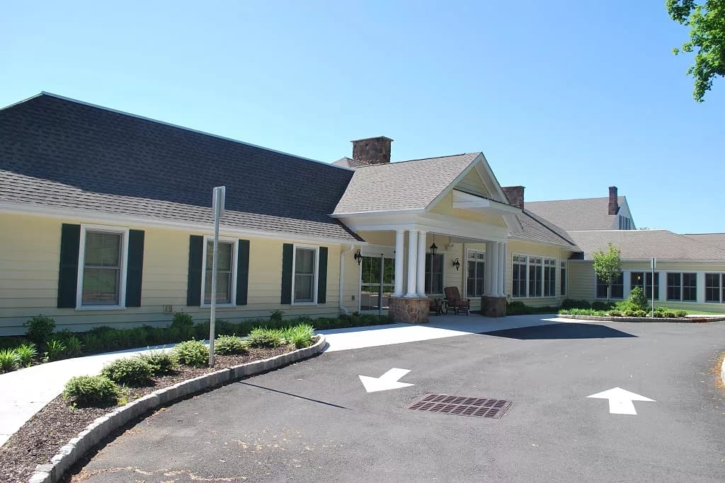 Exterior view of Canterbury Village West Orange with porch