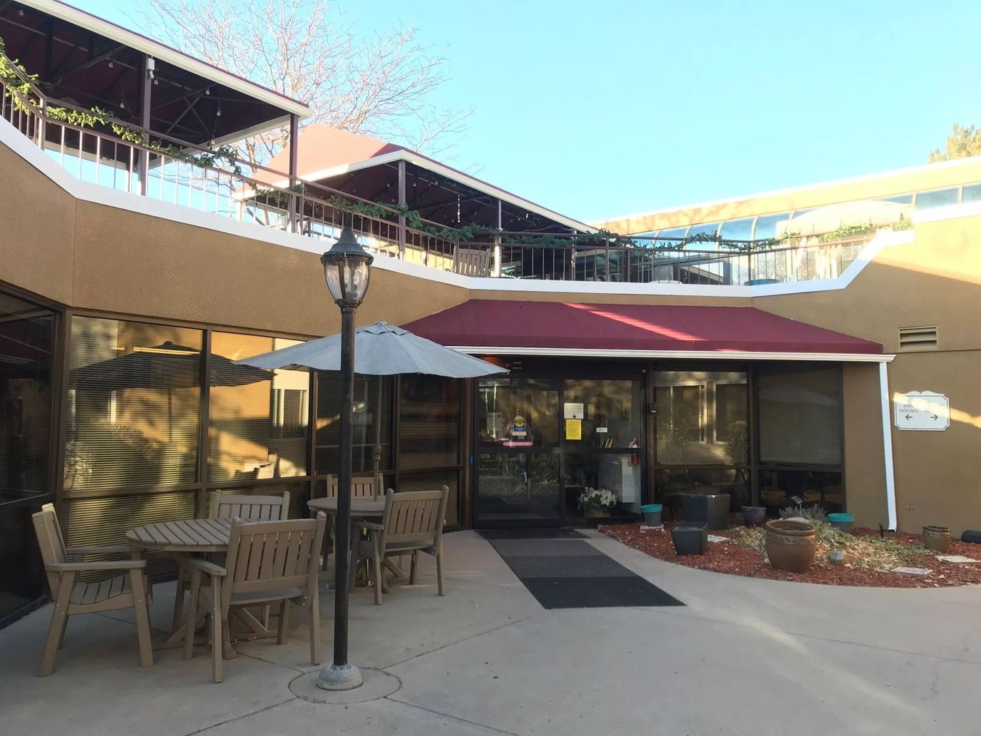 Outdoor seating area with entrance to Cherrelyn Healthcare Center
