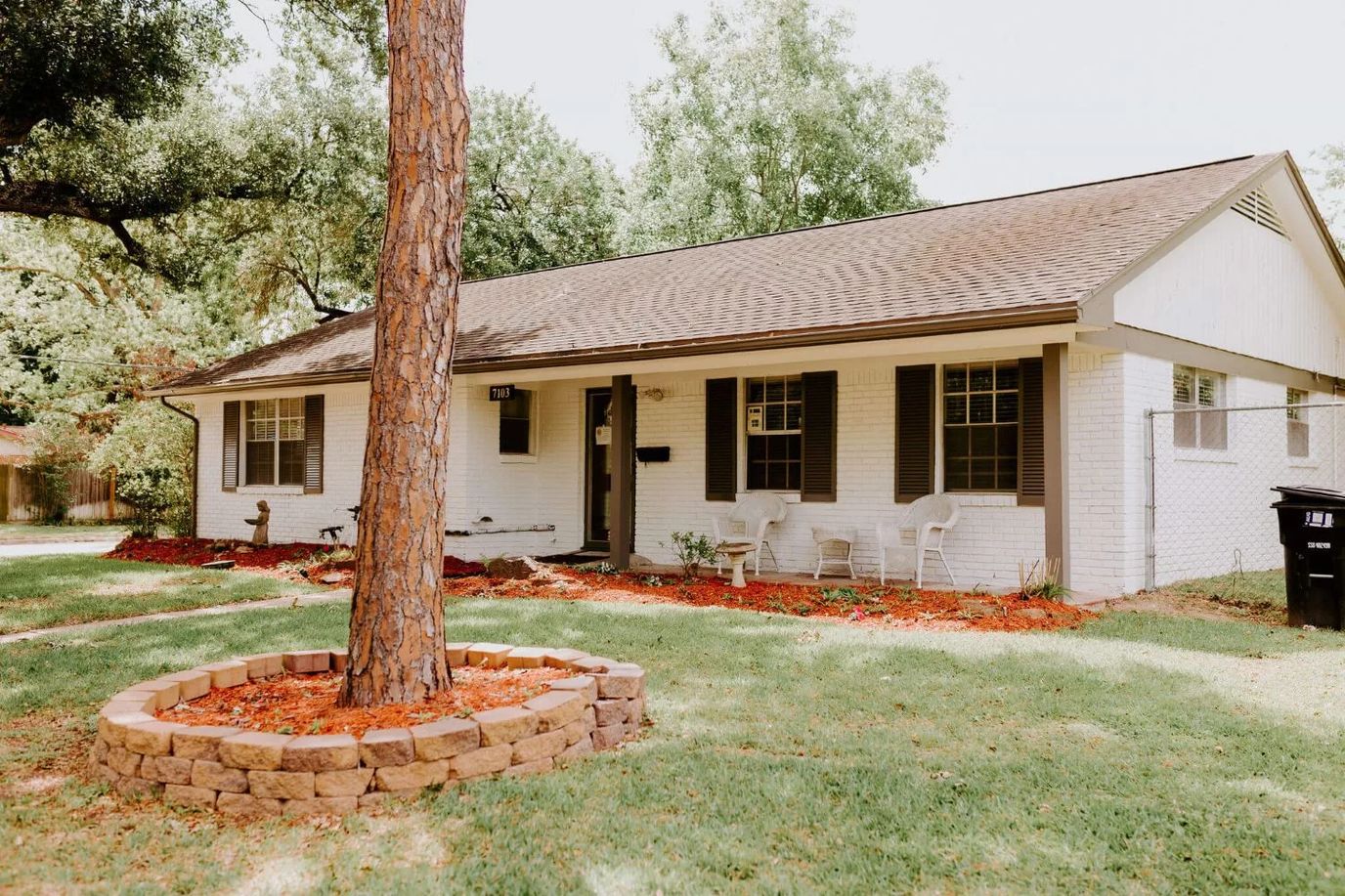 Exterior view of a house surrounded by greenery