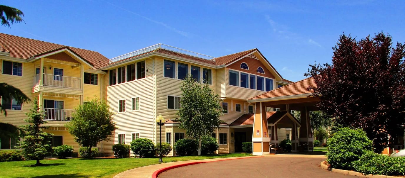 Exterior view of Country Meadows Village with landscaped gardens