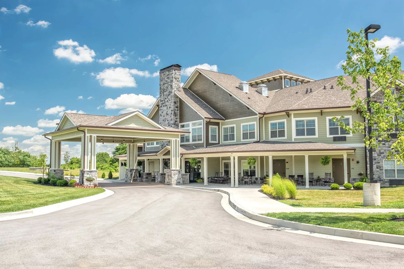 Exterior view of a senior living facility with outdoor space