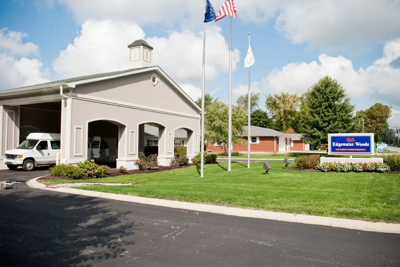 Exterior view of Edgewater Woods with landscaped entrance