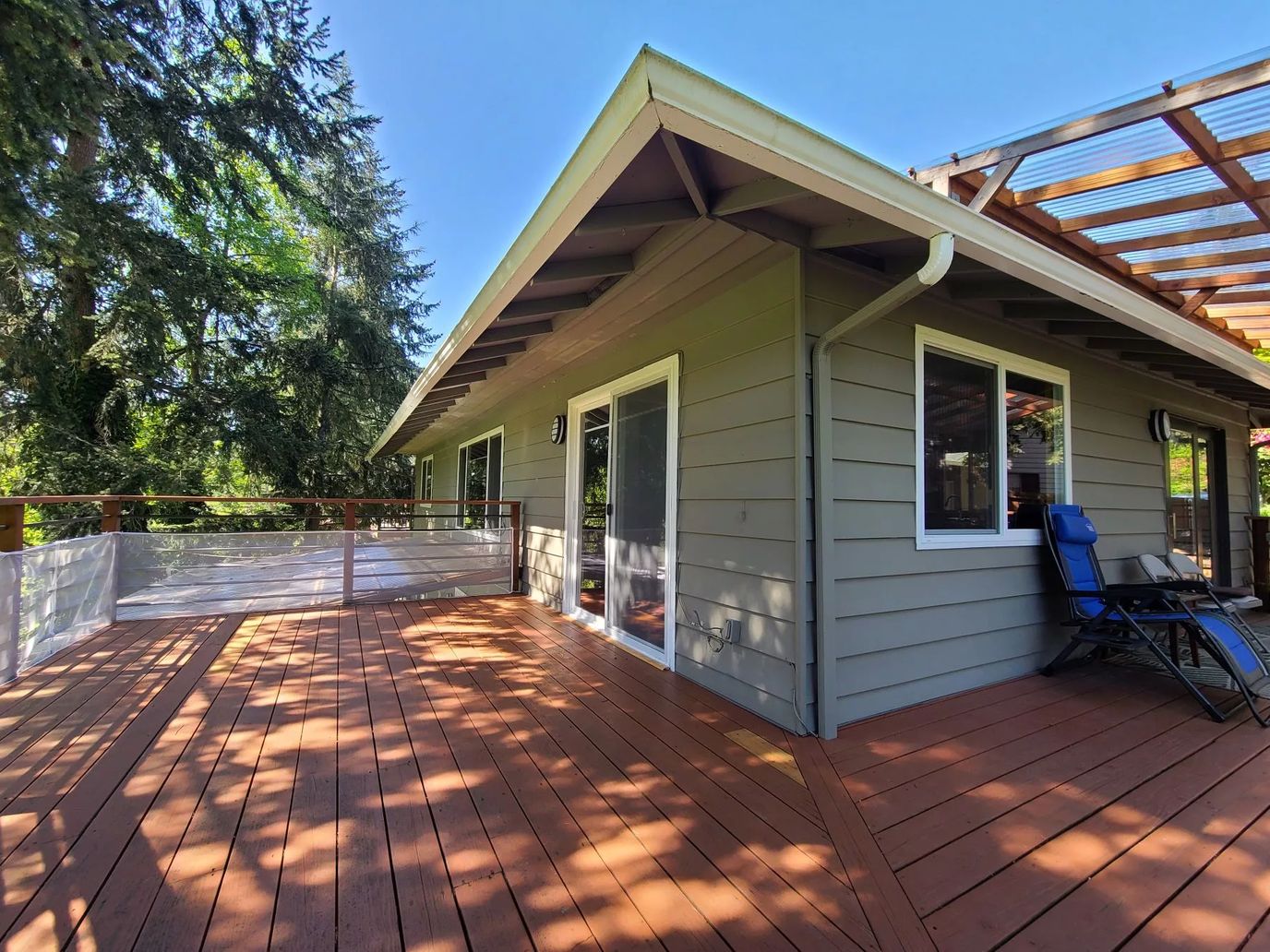 Outdoor patio area with seating and sun shade