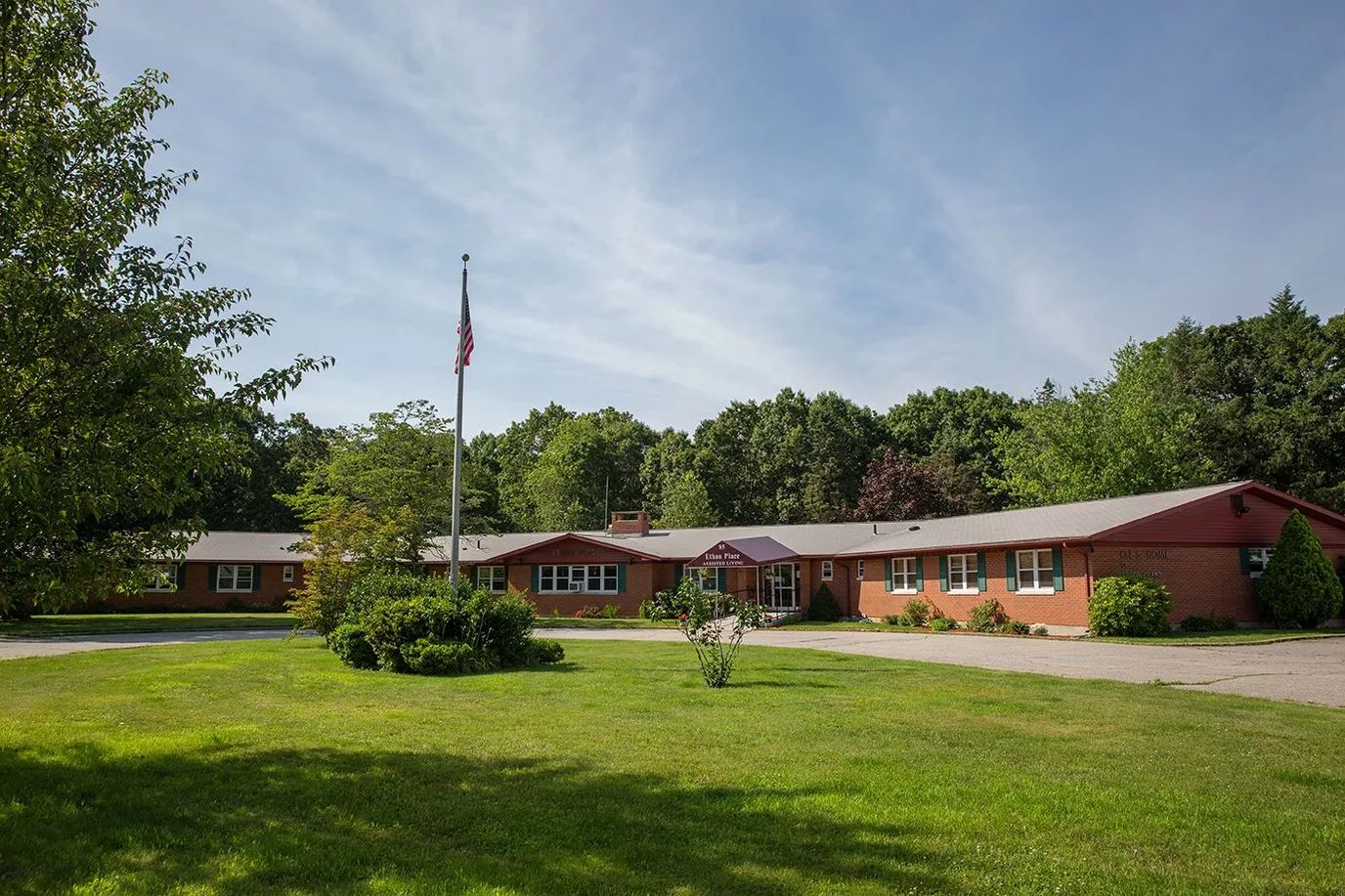 Exterior view of Ethan Place Assisted Living with landscaped grounds