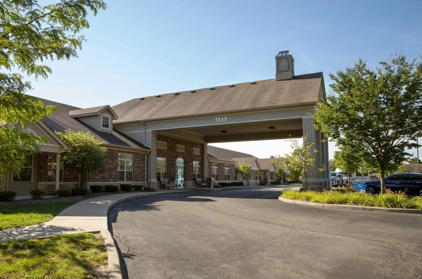 Main entrance of Brownsburg Meadows Assisted Living with landscaping