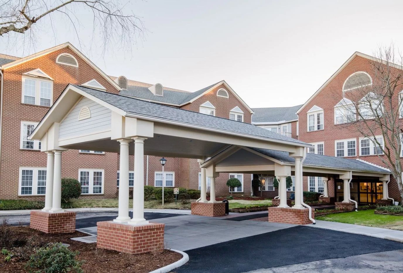 Front entrance of First Colonial Inn with covered entry