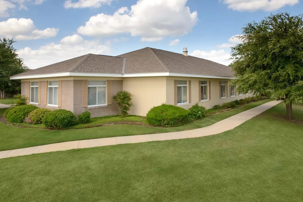 Exterior view of the Garden Terrace building surrounded by landscaped grass