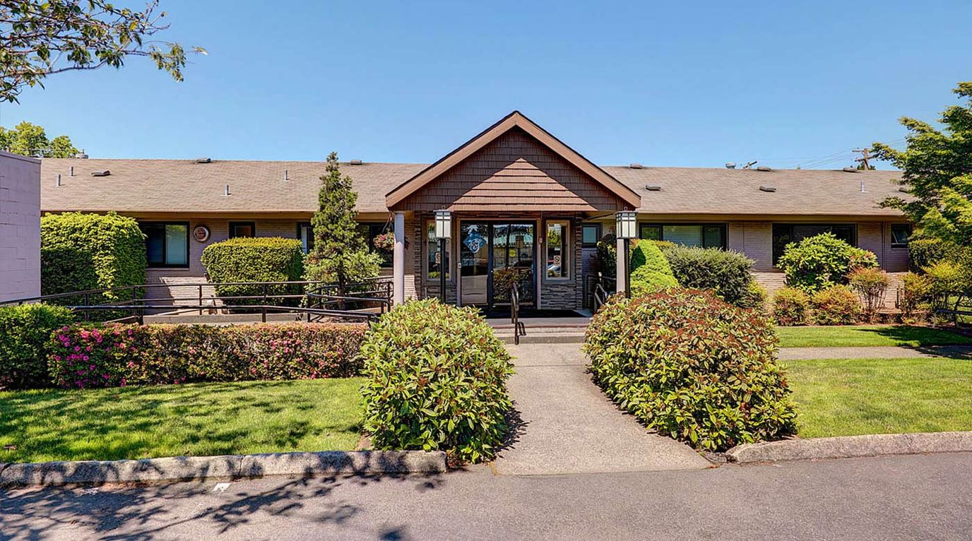 Exterior view of Gateway Care Retirement Center with landscaping