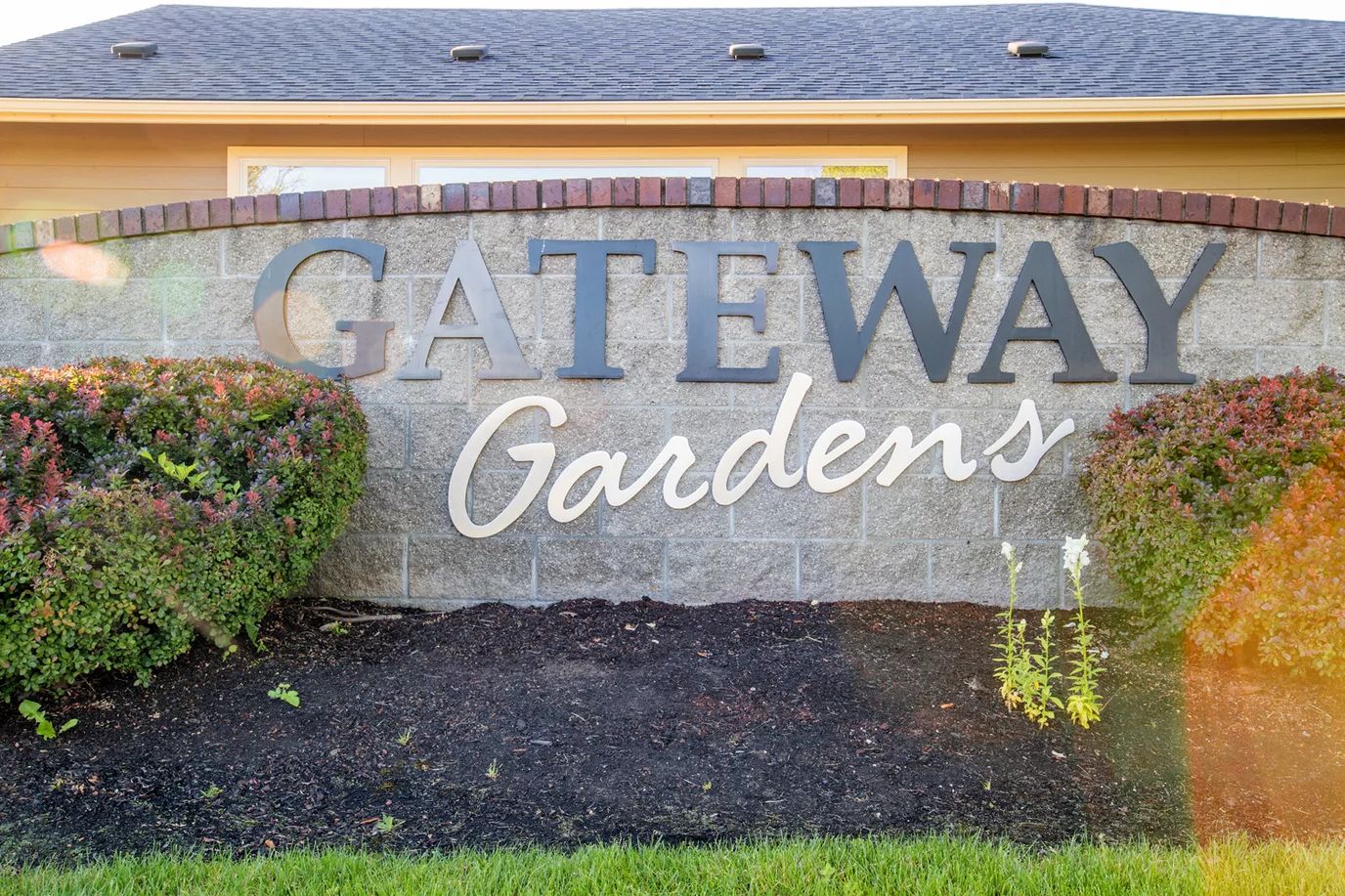 Gateway Gardens facility sign with landscaping