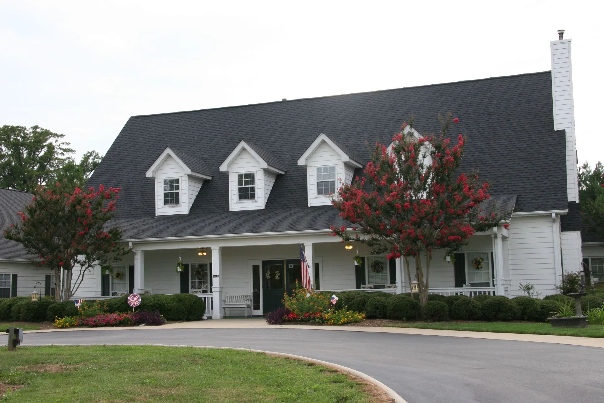 Exterior view of Greenville Glen with landscaped entrance
