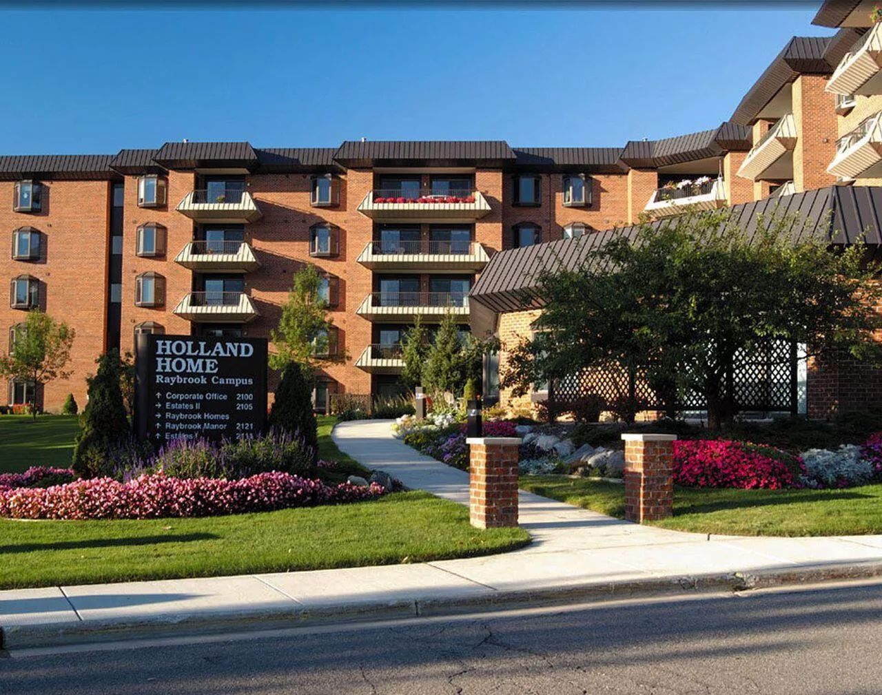 Exterior view of Holland Home Raybrook Campus with gardens