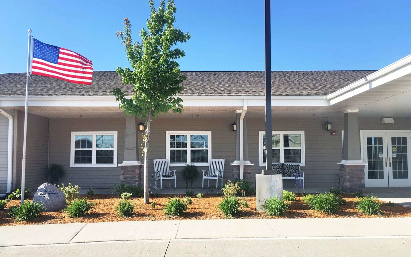 View of the facility's exterior with landscaping and American flag
