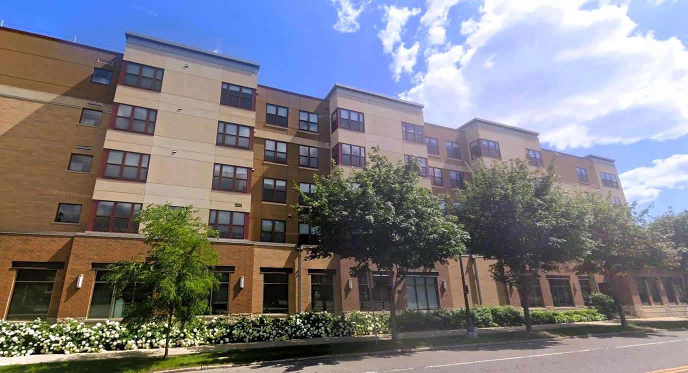 Exterior view of a senior living facility with landscaping