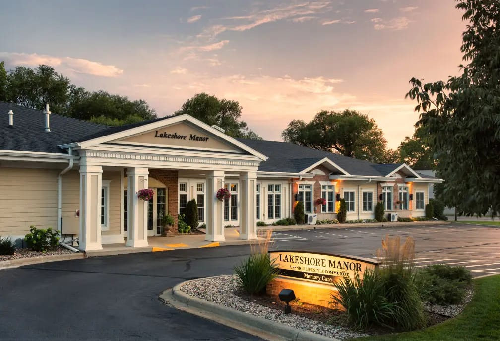 Front exterior of Lakeshore Manor at sunset