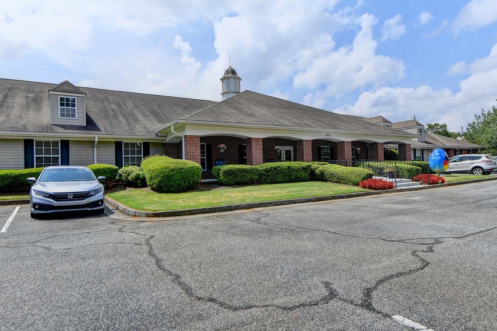 Exterior view of Lotus Village Senior Living facility