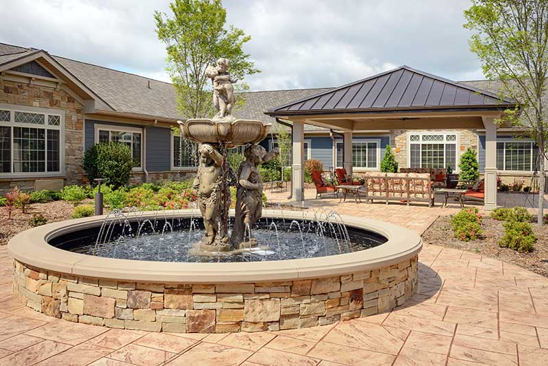 Outdoor courtyard with fountain and seating area