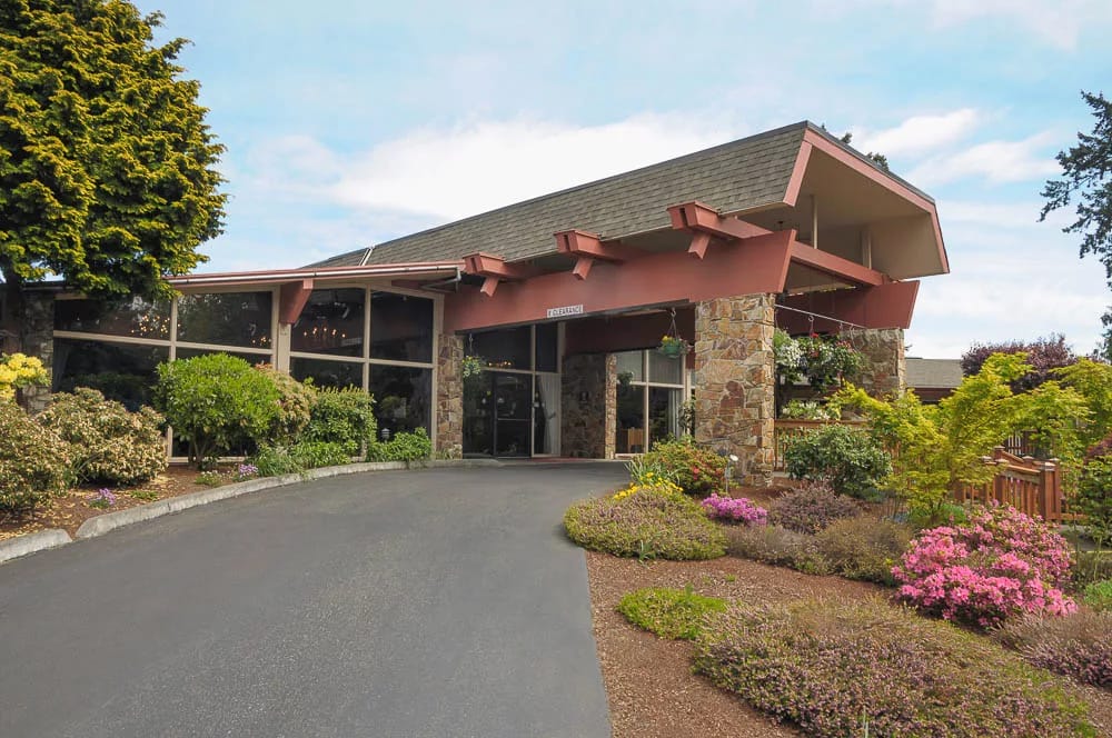 Exterior view of the facility with gardens and landscaping