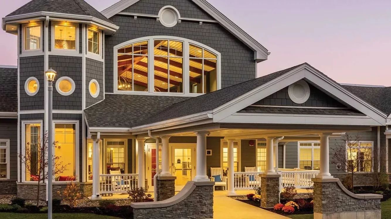 Exterior view of a nursing home facility at dusk