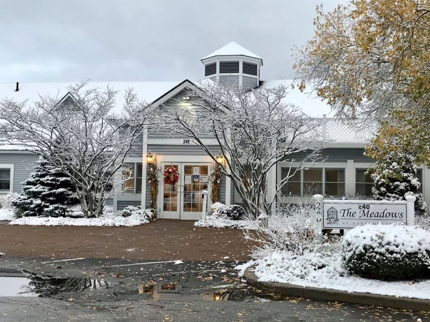 Exterior of The Meadows building covered in snow