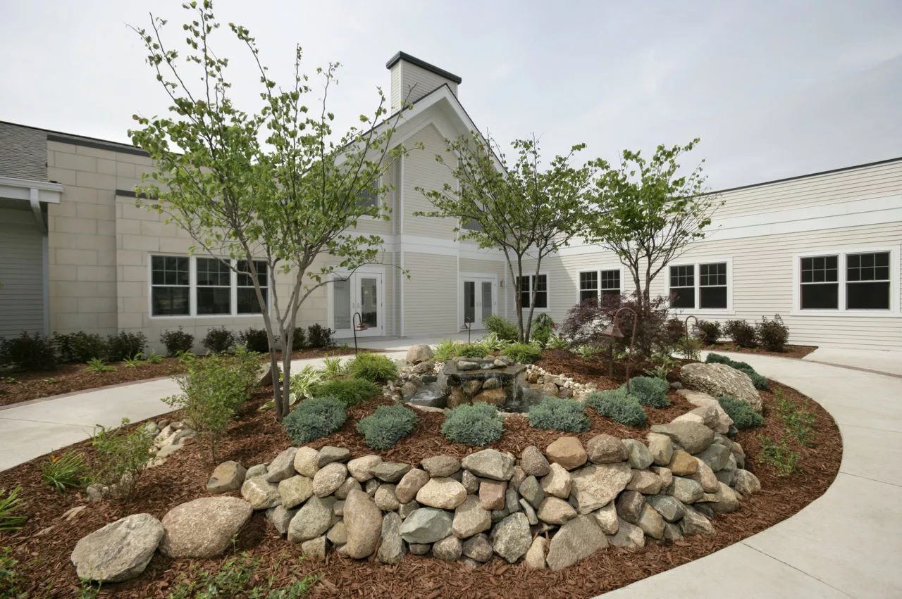 Exterior view of the Oldorf Hospice House with landscaped garden