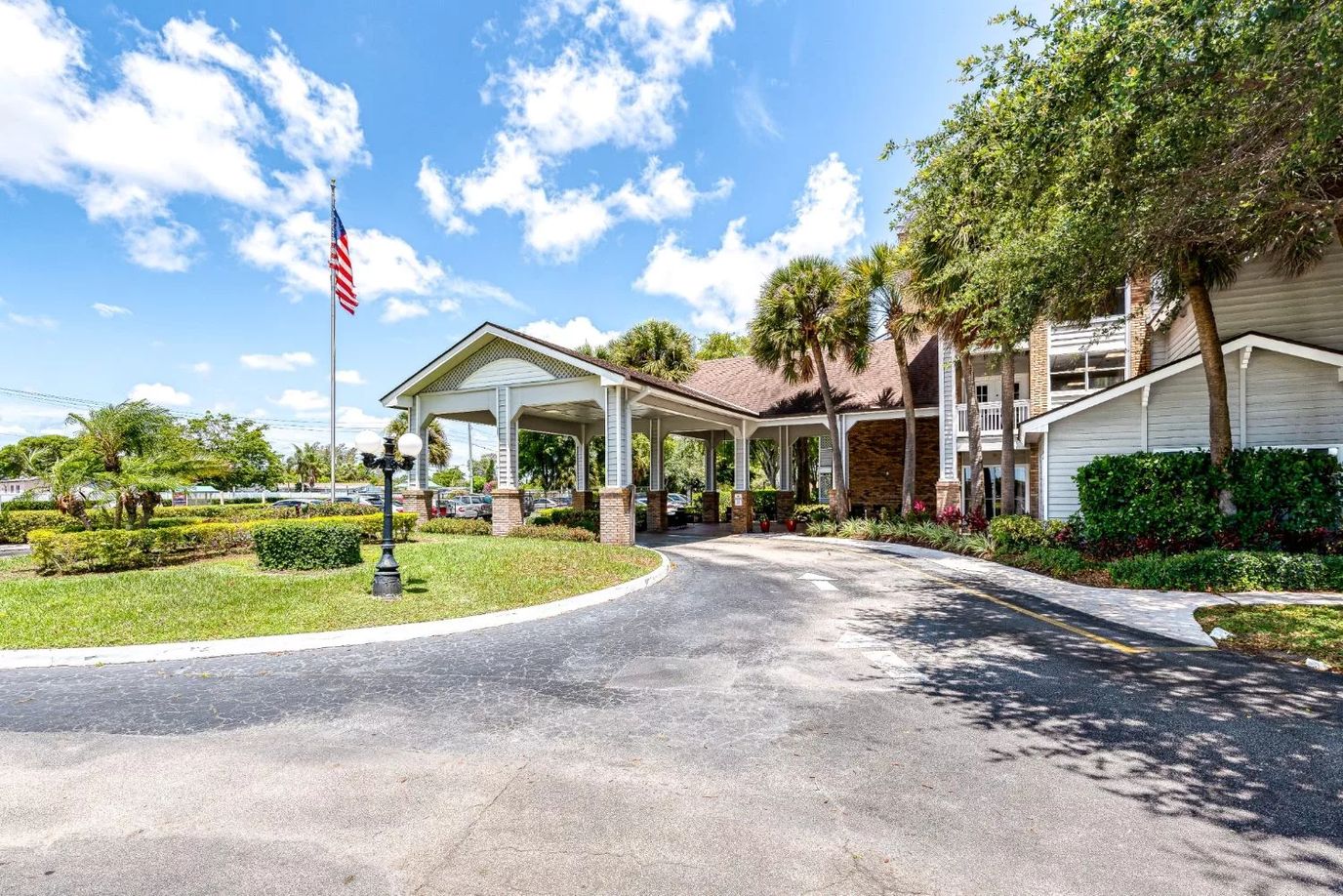 Entrance of Meridian At Lantana with landscaped surroundings