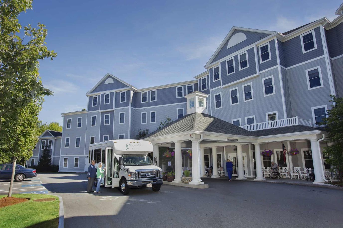 Exterior view of Methuen Village with transport van