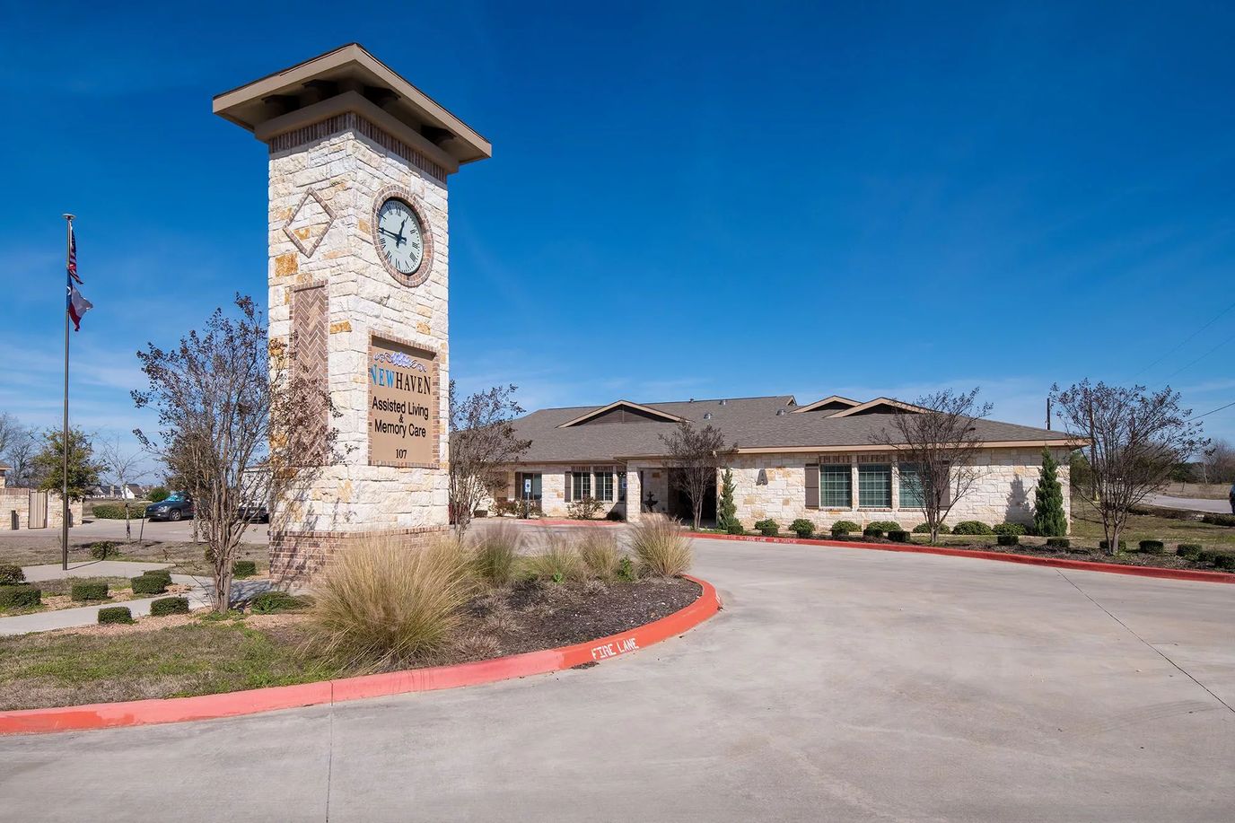 Exterior view of New Haven Assisted Living with clock tower