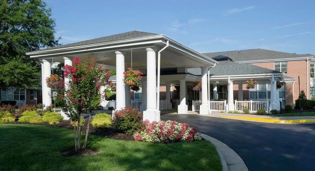 Exterior view of a nursing home entrance with flowers