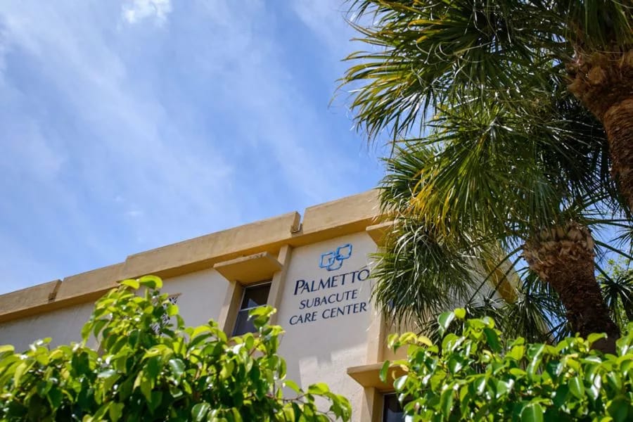 Exterior view of Palmetto Subacute Care Center with logo