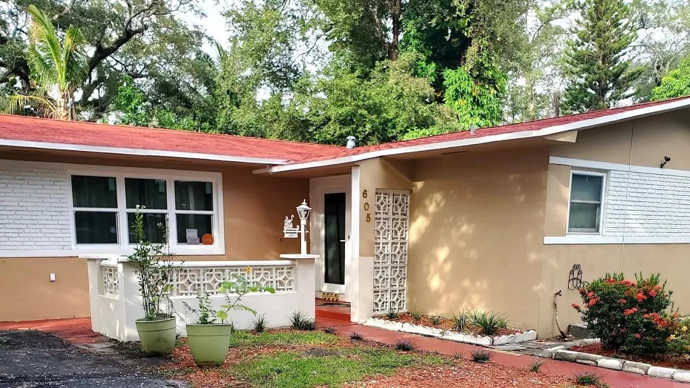 Exterior view of the assisted living facility with garden