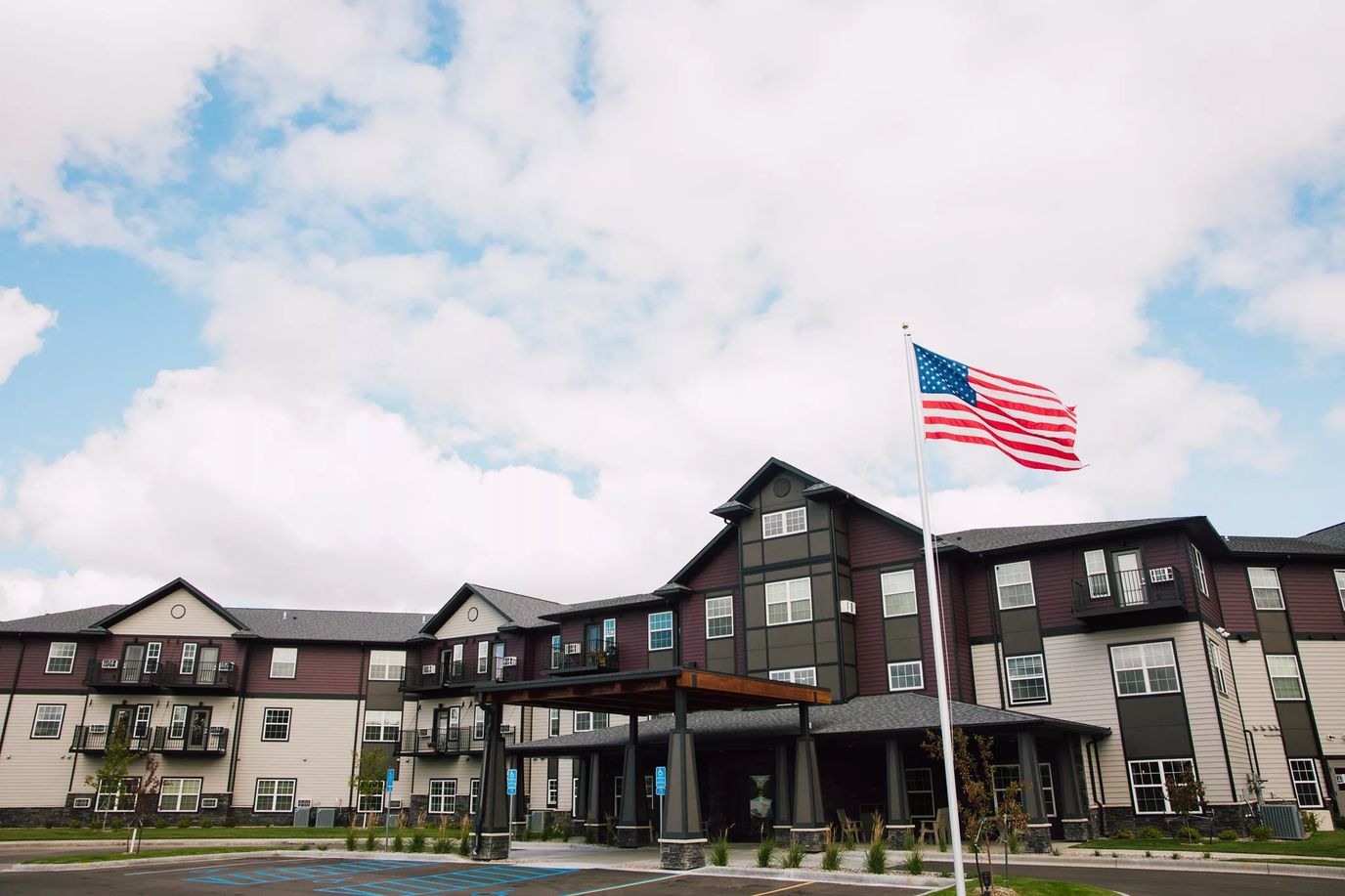Exterior view of Pelican Landing with American flag